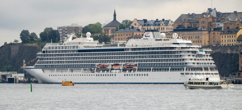 A Viking cruise ship at Stockholm harbor, Sweden with scenic city backdrop.