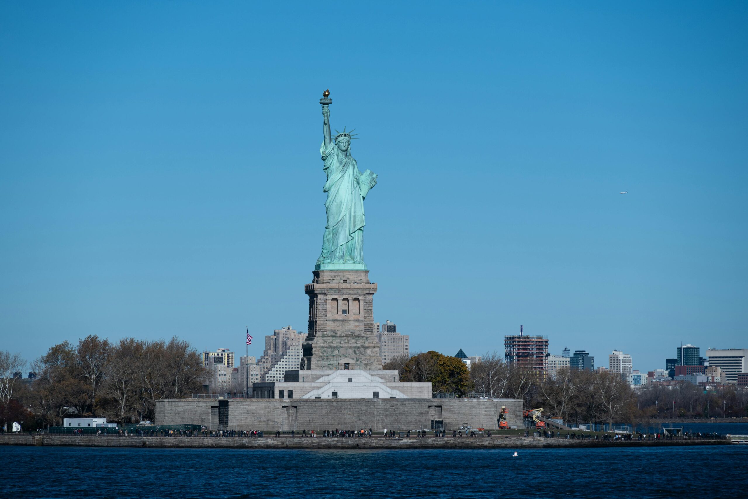 Iconic Statue of Liberty with a clear blue sky on Liberty Island, New York City.