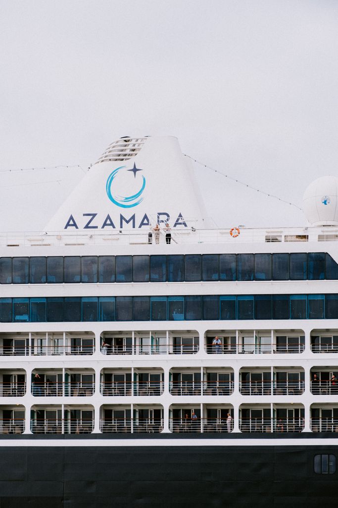 Close-up of a luxury cruise ship, highlighting balconies and elegant design. Ideal for travel and tourism content.